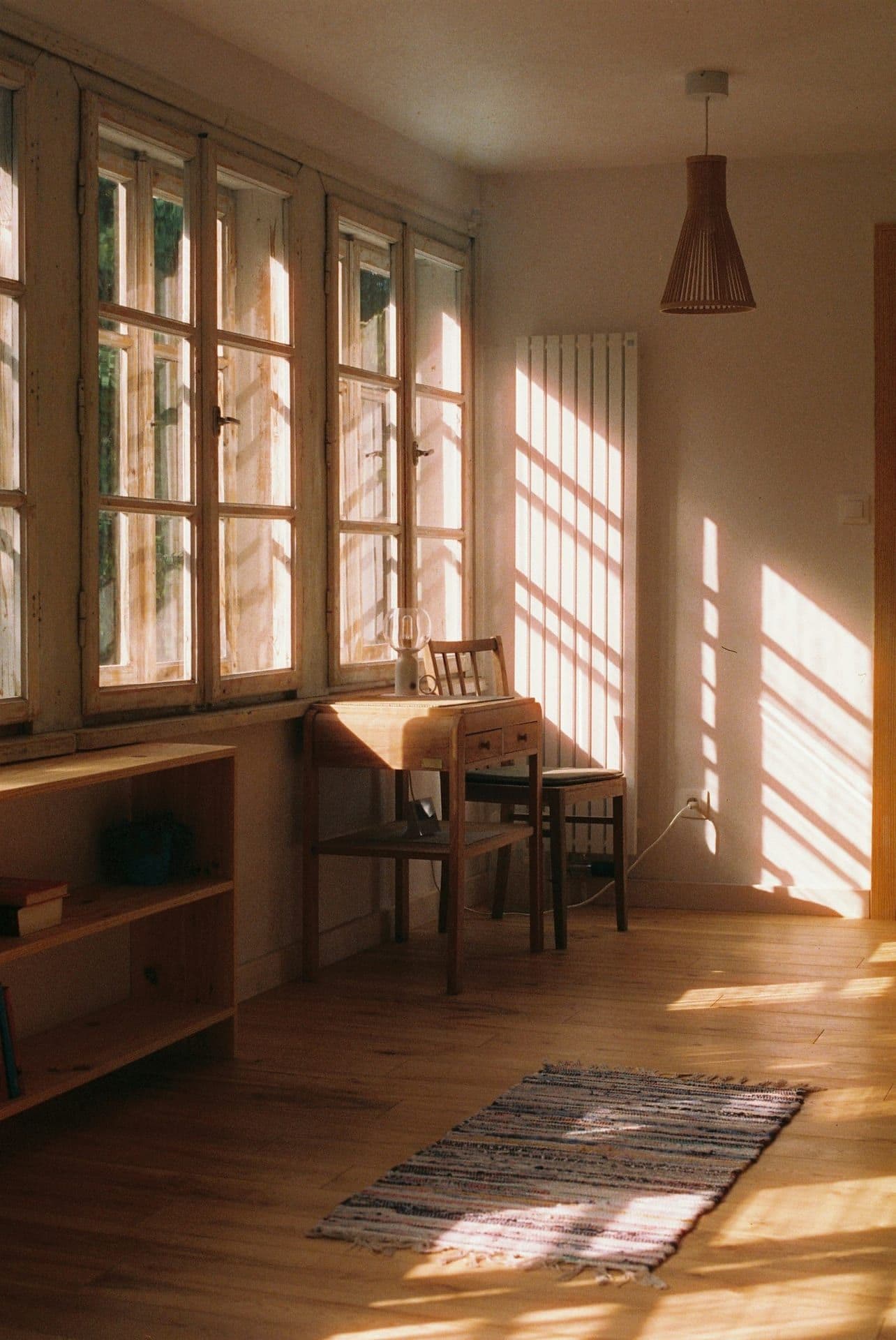 Morning light across a quiet desk, coffee and papers set for a long conversation